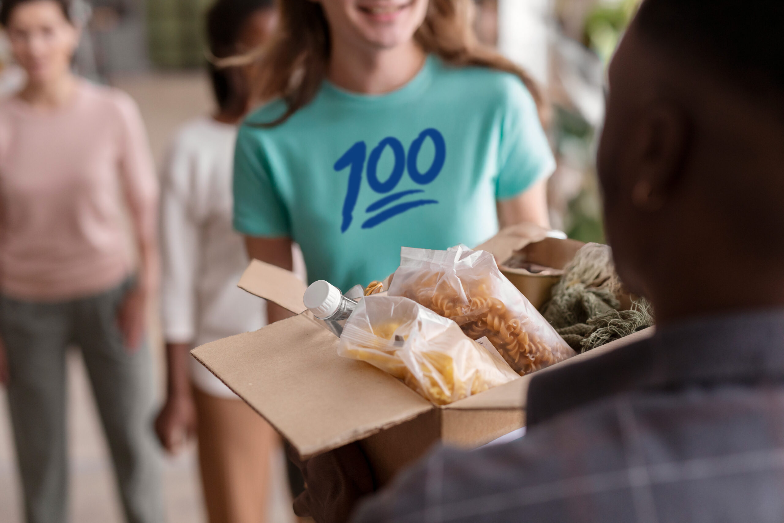 Student volunteer handing a donation box